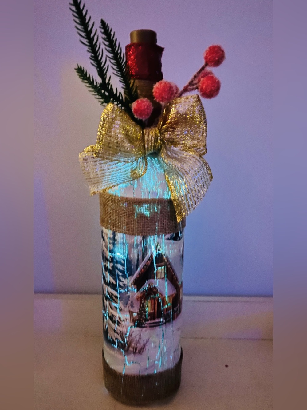 Gold Bow Holiday Bottle Decor with Pink Berry Accents and Lights